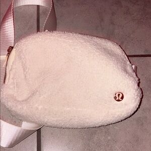 Fluffy white and gold lululemon belt bag